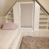 Low platform bed in black lacquer with a matching headboard rail